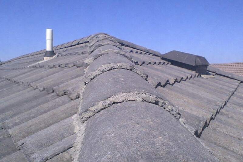 The ridge and slope of a concrete tile roof on a two-story Gilbert house