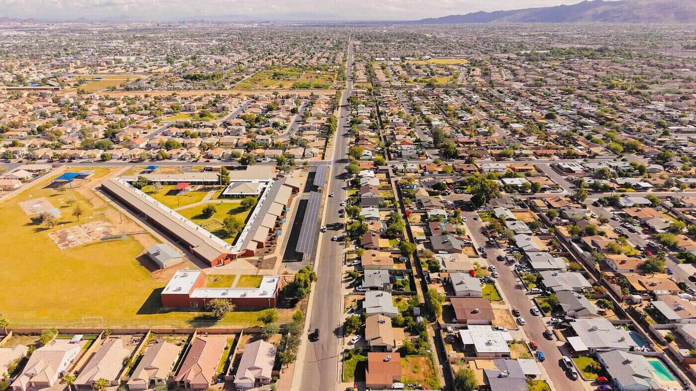 Aerial view of an older Arizona residential grid of single-story houses